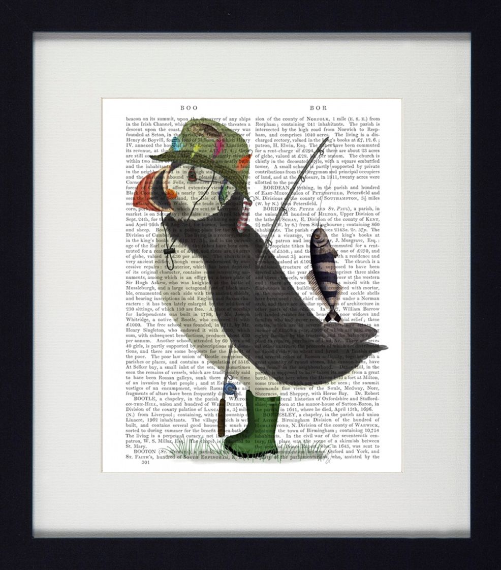 Framed artwork of a puffin fishing on a printed page