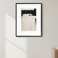 Abstract art piece with black, white, and gray tones on a white background
