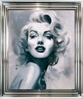 Framed artwork of a stylized portrait with a silver frame