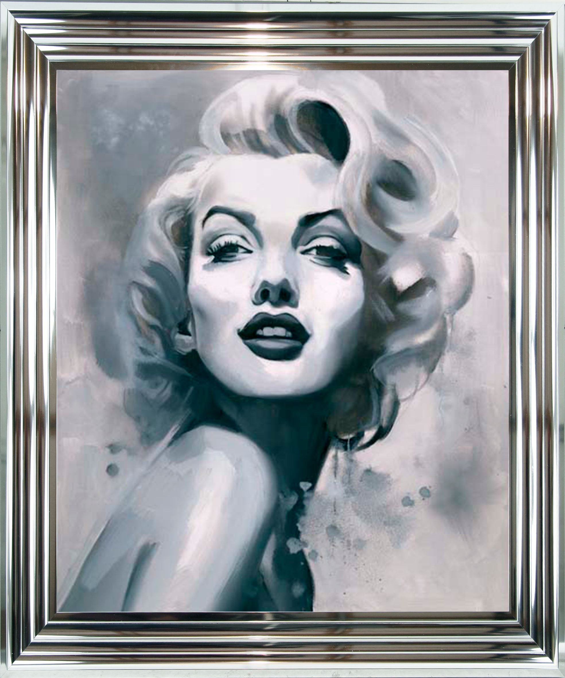 Framed artwork of a stylized portrait with a silver frame