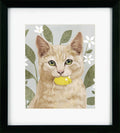 Framed artwork of a cat with a yellow toy in its mouth against a floral background