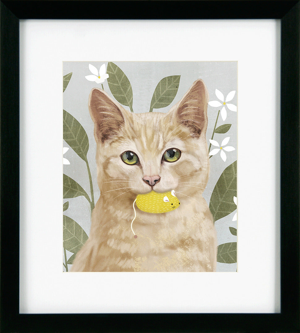 Framed artwork of a cat with a yellow toy in its mouth against a floral background