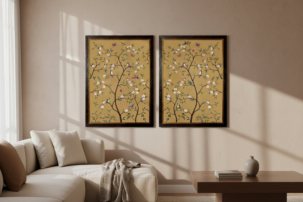 Two framed artworks with floral and bird designs on a beige background